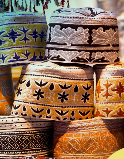 Hikers on a desert dune in Oman